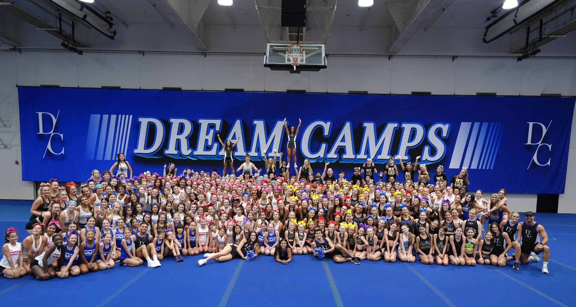 Dream Camps group in front of the banner
