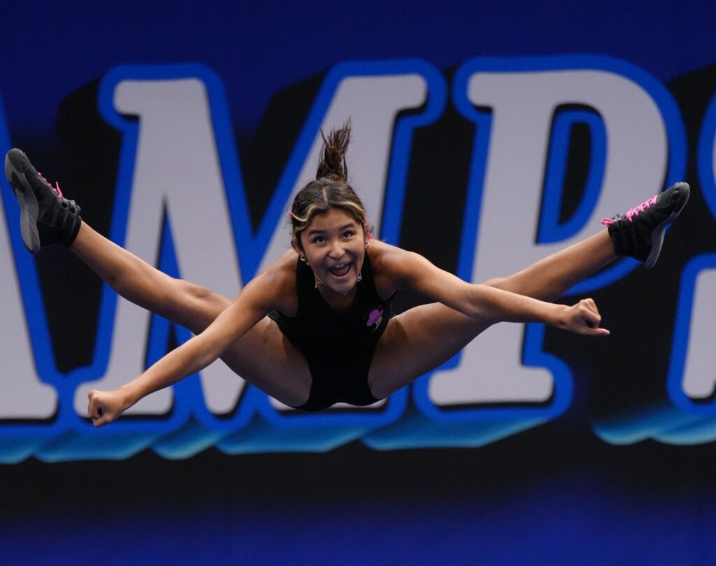 Camper toe-touch jump at Dream Camps